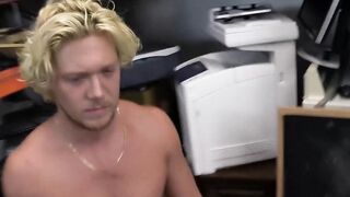 Athletic guy sucks on two rock hard cocks in kinky pawnshop