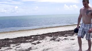 Muscled lifeguard ass stretched at the beach