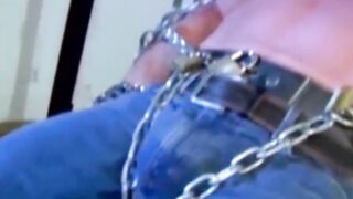 MuscleJockBound.com - Submissive man futilely struggles while in heavy chains, domina