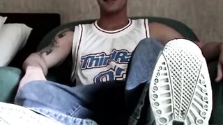 Muscled guy Criss jerks off until he shoots his cum while showing off naked feet