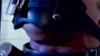 MuscleJockBound.com - Muscular man silenced with a ball gag while being heavily chain