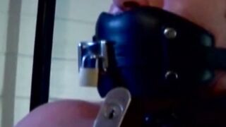 MuscleJockBound.com - Muscular man silenced with a ball gag while being heavily chain