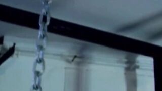 MuscleJockBound.com - Muscular man silenced with a ball gag while being heavily chain