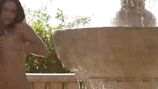 Lovely babe Cosmo displaying her perfectly shaped ass and pussy by the water fountain