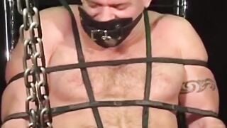 MuscleJockBound.com - Inked man in tight underwear tied up and subdued in a sensual a