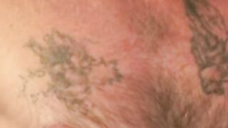 Tattooed mature amateur masturbates small cock and cums