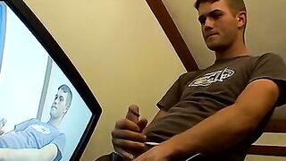 Thug pleases himself with his hands next to recording TV