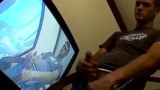 Thug pleases himself with his hands next to recording TV