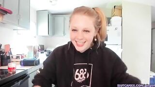 beauty blonde next door women is streaming inside the kitchen