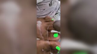 Cream On Bright Green African Feet And Foot