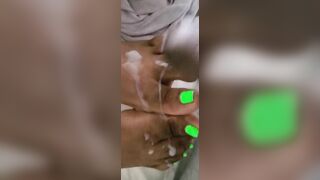 Cream On Bright Green African Feet And Foot