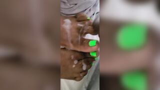 Cream On Bright Green African Feet And Foot