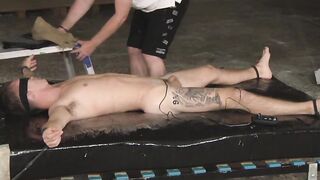 Master Sebastian Kane pleasures his captive by sucking and rubbing his dick