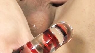 Skinny twink Ashton Cody shoves candy cane dildo up his ass