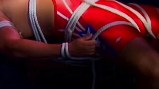 MuscleJockBound.com - Inked man in uniform struggles to free himself from tight ropes
