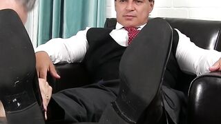 Mature Latino businessman enjoys his foot being licked