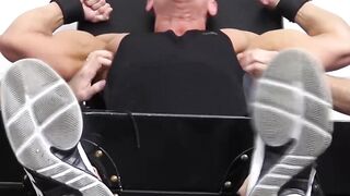 Two dudes tickle hunks feet and the rest of his body too