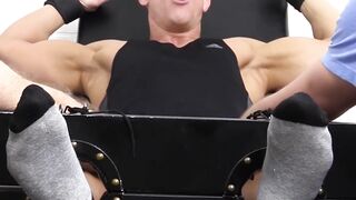 Two dudes tickle hunks feet and the rest of his body too