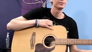 Young man plays guitar before dick stroking and cumming