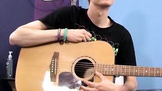 Young man plays guitar before dick stroking and cumming