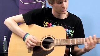 Young man plays guitar before dick stroking and cumming