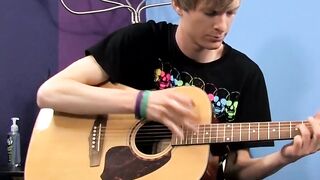 Young man plays guitar before dick stroking and cumming