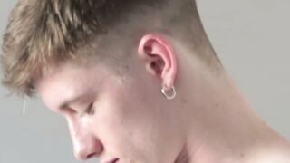 Barebacked twink cums with a dick in his ass