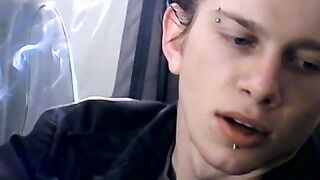 Attractive Ian Madrox is blowing smoke and starts stretching his cock in his smoky je