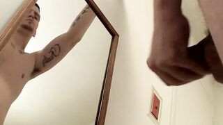 Horny straight thug works out a load in front of the mirror