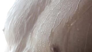 Young man strips to wash his tight body before masturbating