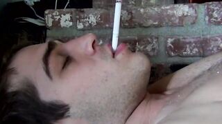 Sexy Austin smokes two at once before stroking his cock