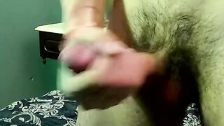 Young man goes naked and strokes his dick before cumming