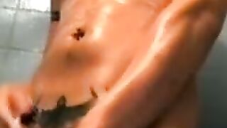 Amateur tattooed twink with a tan showers in classics porn