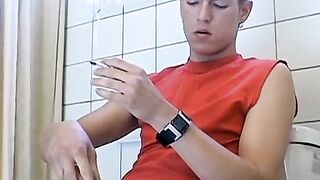 Attractive Yuri fires up his cig and sits on the toilet for his hot smokin and stroki