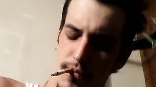 Straight rocker Axel plays his guitar and his throbbing cock with his pack of cigaret
