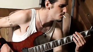 Straight rocker Axel plays his guitar and his throbbing cock with his pack of cigaret