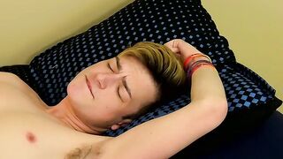 Twink tugs on his big fat boner and shoves a toy inside him