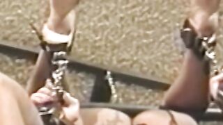 Busty blonde sub tied up for spanking in BDSM dungeon