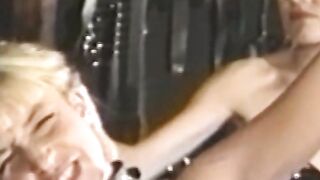 Busty blonde sub tied up for spanking in BDSM dungeon