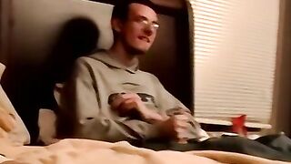 Two amateur freaks jerk off together in a cheap motel room