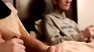 Two amateur freaks jerk off together in a cheap motel room