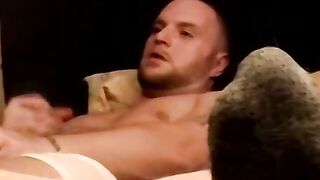 Two amateur freaks jerk off together in a cheap motel room