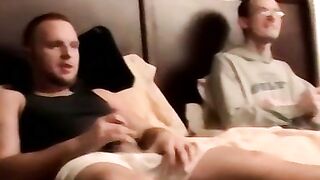 Two amateur freaks jerk off together in a cheap motel room