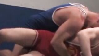Over on the wrestling mat, RSS exclusive Taurus, in a tight blue singlet, and Julien