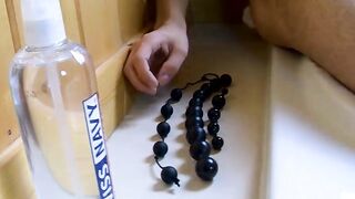 Zach Hunter pulls out his toy while taking a steamy bath