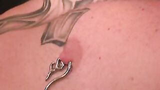 Bald stud with nipple piercings strokes his hard fat dick