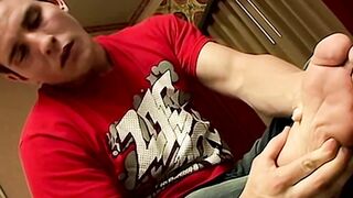 Barefoot jock Dylan Mclovin kicks back on the bed to jack off his big cock