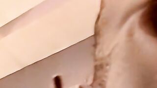 Young amateur strokes his cock and receives a helping hand
