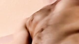 Young amateur strokes his cock and receives a helping hand