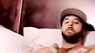 Young amateur strokes his cock and receives a helping hand